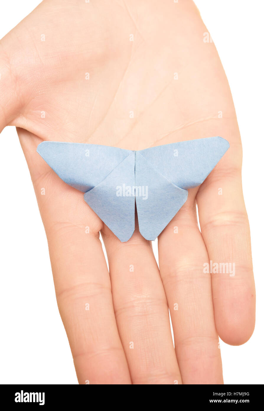 Origami Schmetterling auf einer Frau die hand isolierten auf weißen Hintergrund Stockfoto