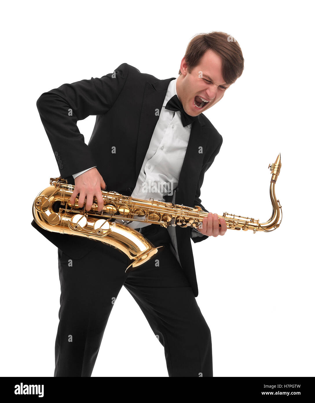 Saxophonist spielt Saxophon Hardrock mit lustigem Gesicht. Stockfoto