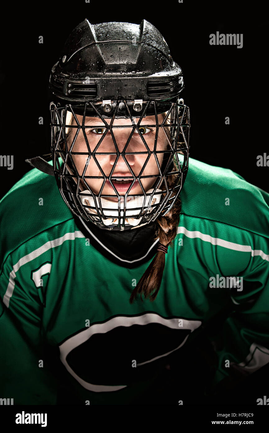 Ringelten Spieler tragen Grünes Trikot mit Helm und Käfig; Regina, Saskatchewan, Kanada Stockfoto