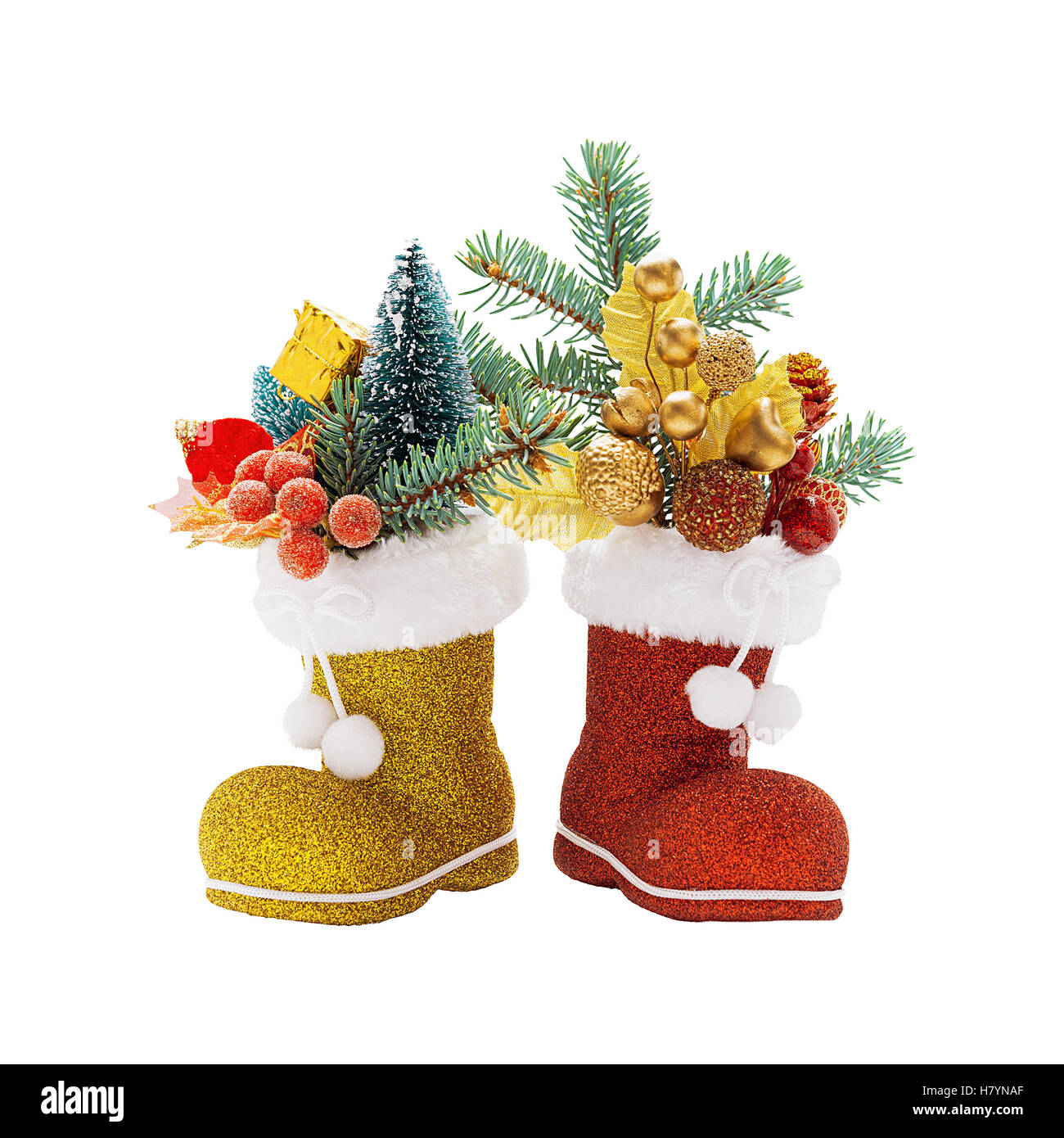 Rote und goldene Stiefel von Santa Claus mit Weihnachtsschmuck isoliert Stockfoto