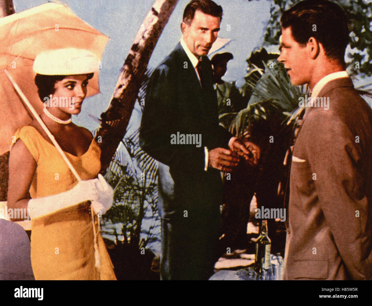 Erfolgssichere Erde, (ISLAND IN THE SUN) USA 1957, Regie: Robert Rossen, JOAN COLLINS, MICHAEL RENNIE, STEPHEN BOYD, Key: Sonnenschirm Stockfoto