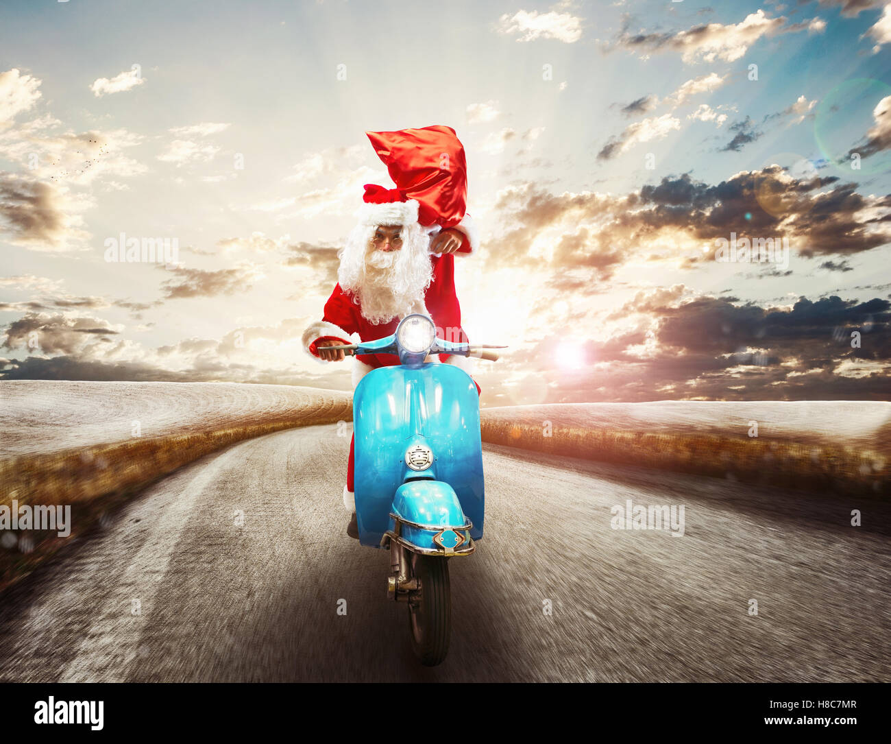 Schnelle Weihnachtsmann auf Motorrad Stockfoto