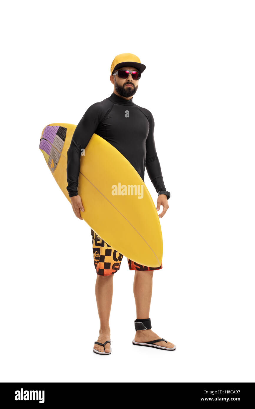 In voller Länge Portrait von ein Surfer in einen Neoprenanzug hält ein Surfbrett isoliert auf weißem Hintergrund Stockfoto