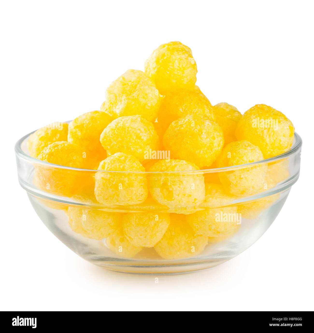 Gelbe Maiskugeln in transparente Platte isoliert auf weißem Hintergrund Stockfoto
