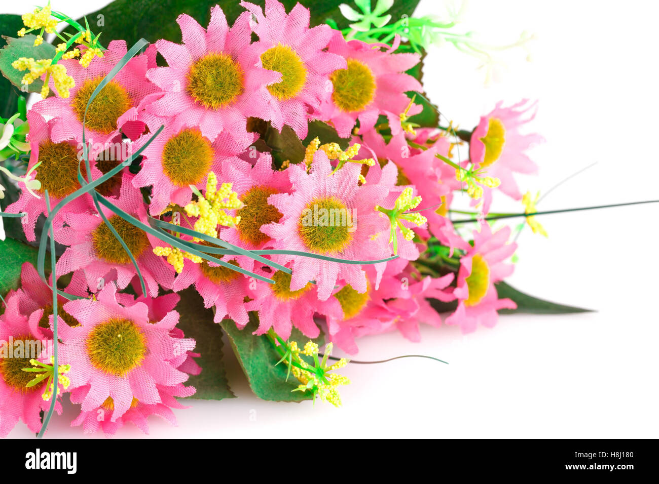 Rosa Stoffblumen isoliert auf weißem Hintergrund. Stockfoto