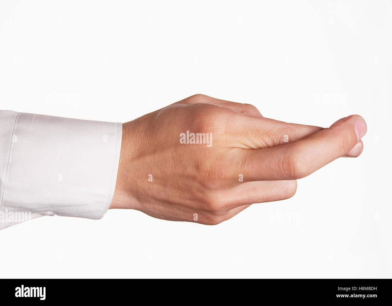Nahaufnahme von Hand mit Daumen vor weißem Hintergrund Stockfoto