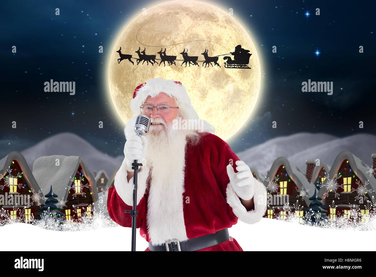 Santa Claus Weihnachten Gesang Mikrofon Stockfoto