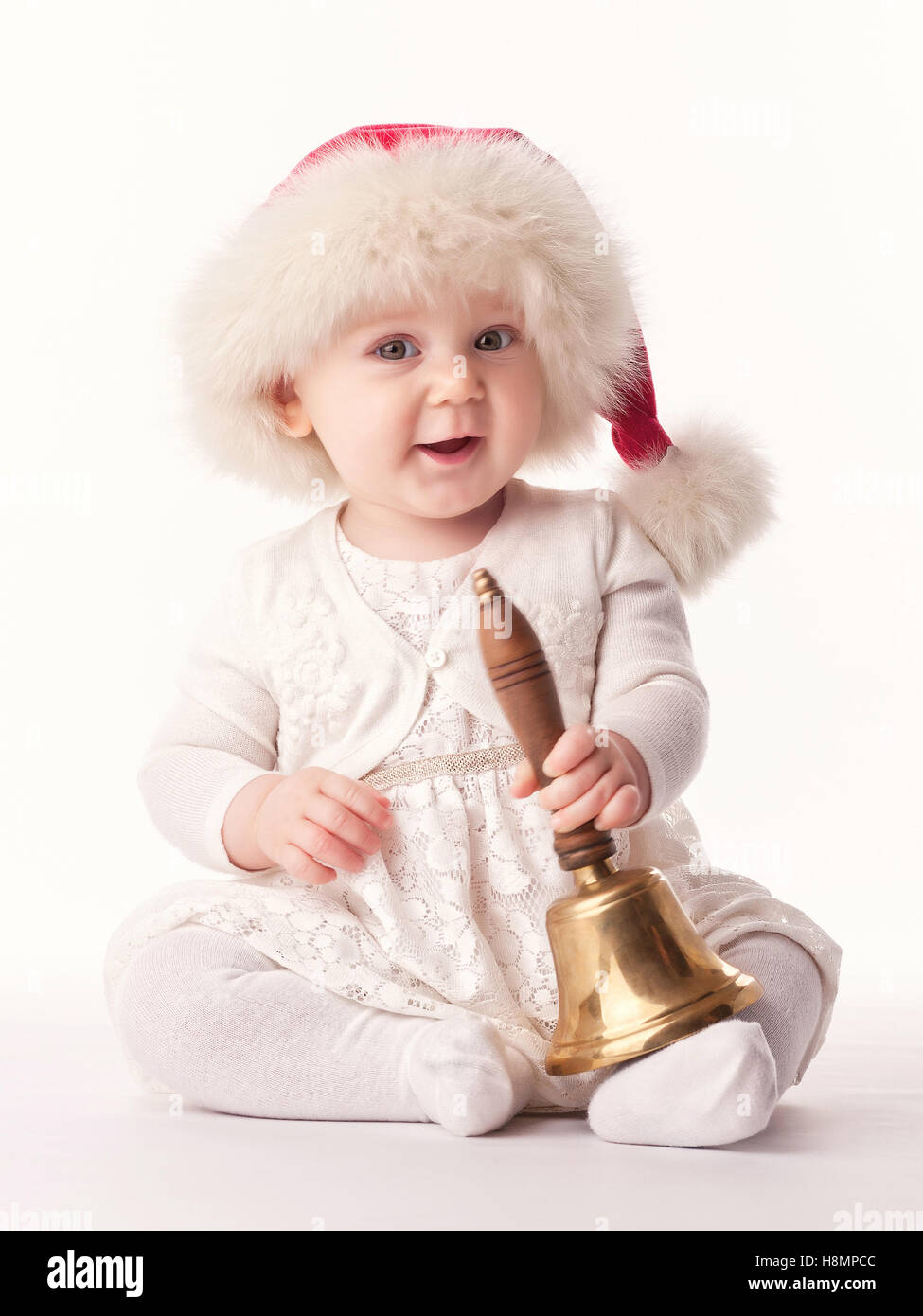 Baby Weihnachtsmann mit rotem Fellmütze Stockfoto