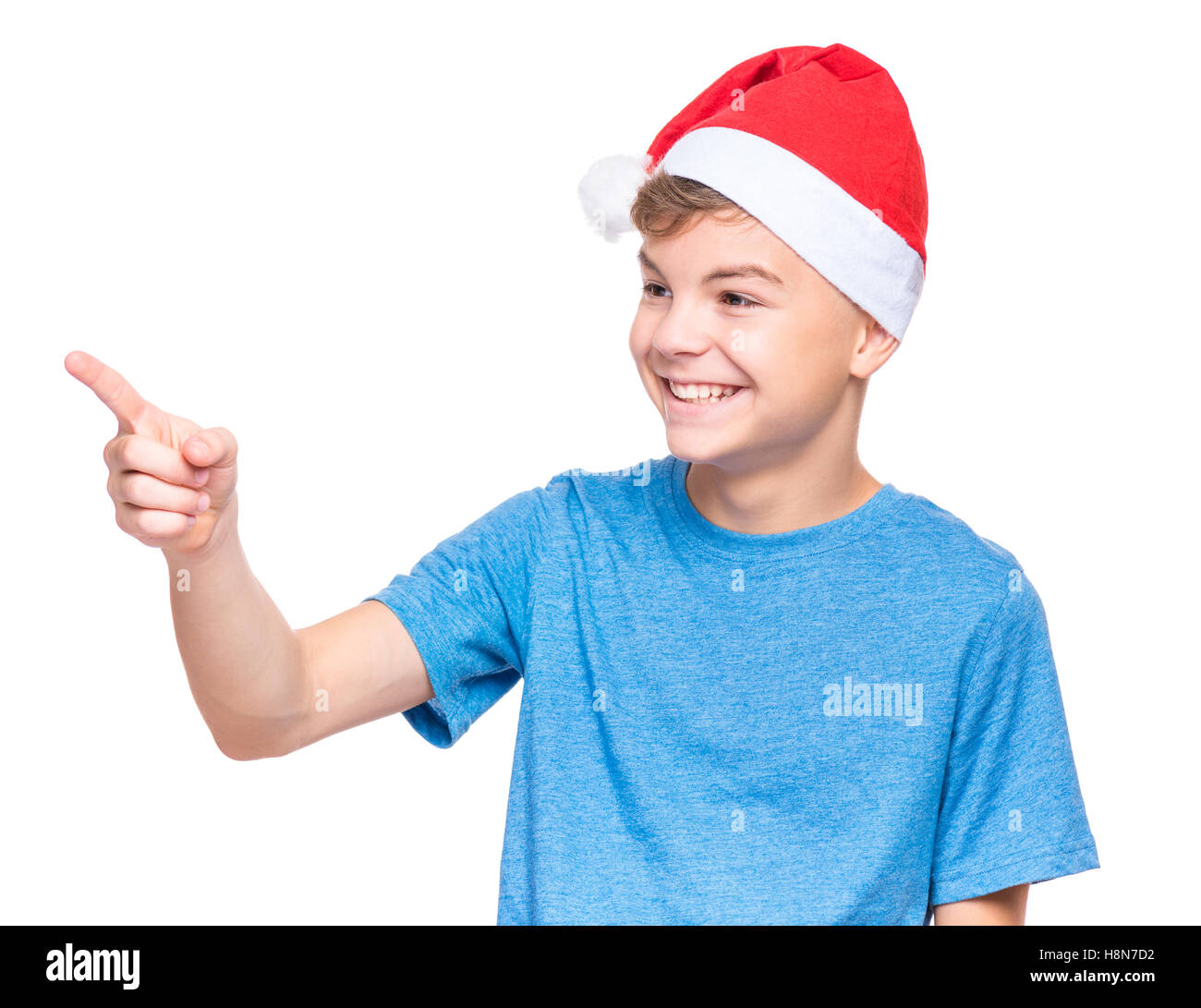 Teenboy Weihnachtsmann Hut Stockfoto