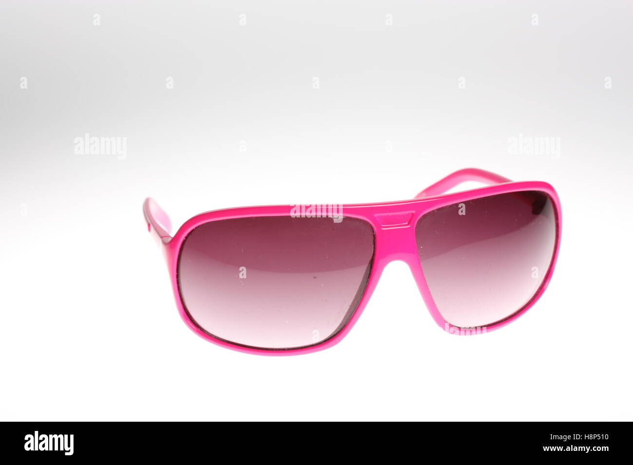 rosa Sonne Brille Stillleben Lichtkasten erschossen Stockfoto