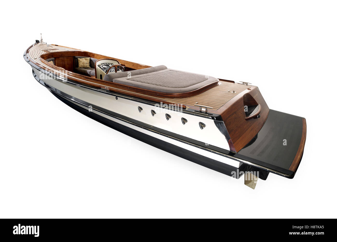 Holzboot mit Lenkrad und Armaturenbrett isoliert auf weiss Stockfoto