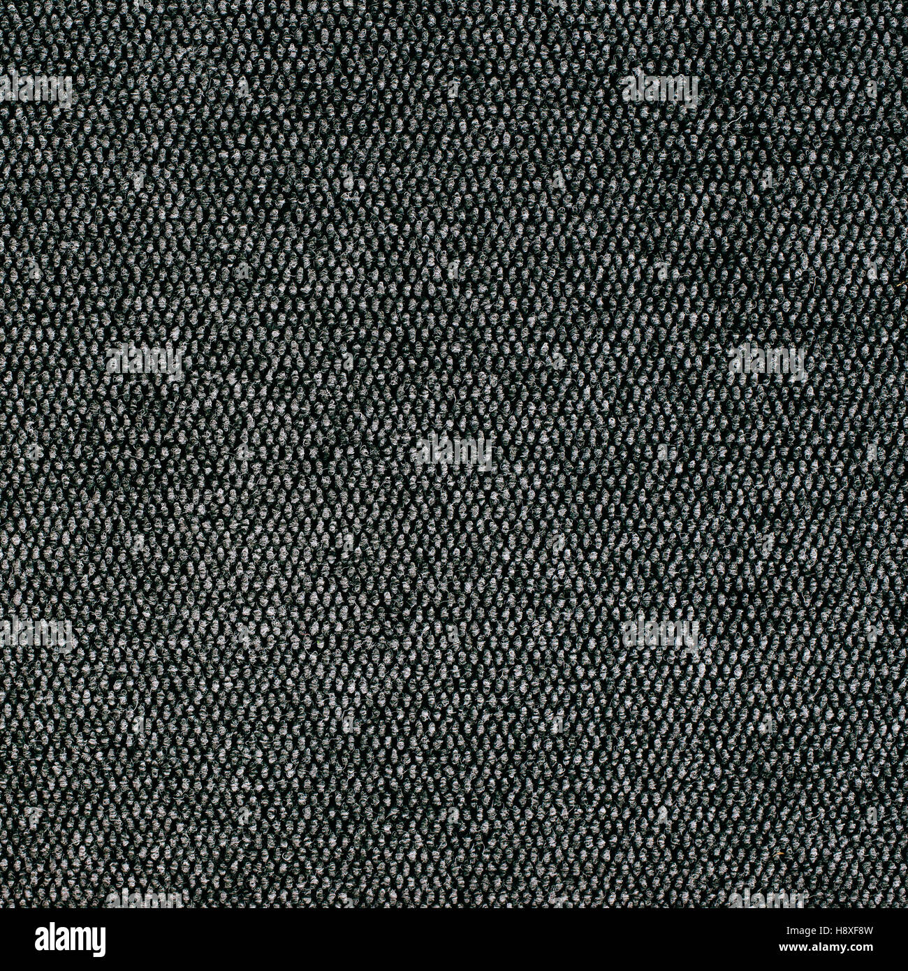 Graue grobe Textur Teppichoberfläche als Hintergrund, detaillierte Gewebematerial für Hintergrund Stockfoto