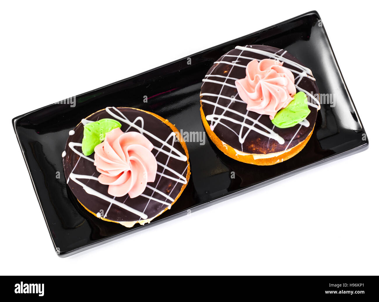 Bunte Kekse Kuchen Busch mit Sahnehäubchen und Creme-Füllung. Studio Photo Stockfoto