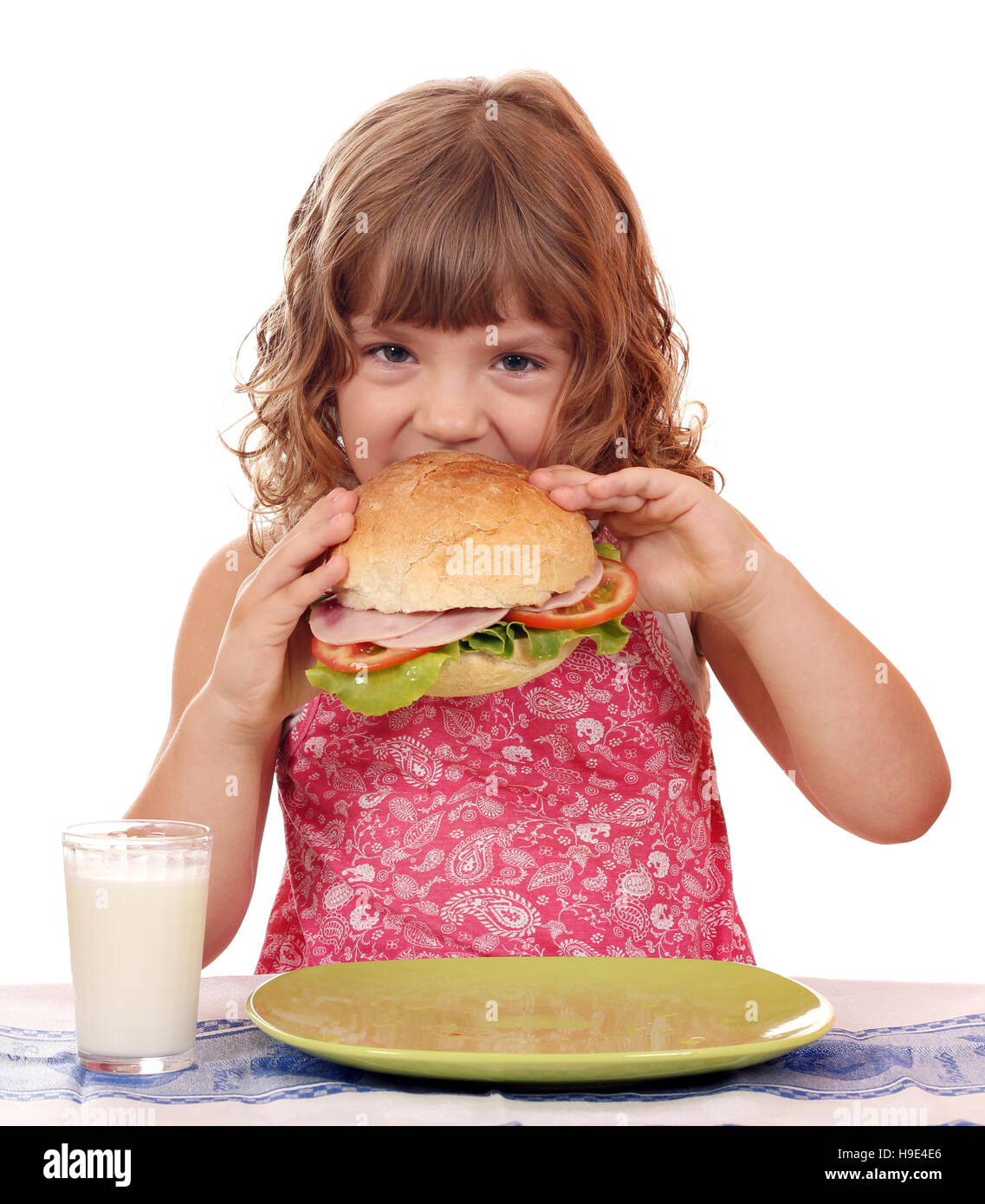 hungrige kleine Mädchen essen sandwich Stockfoto