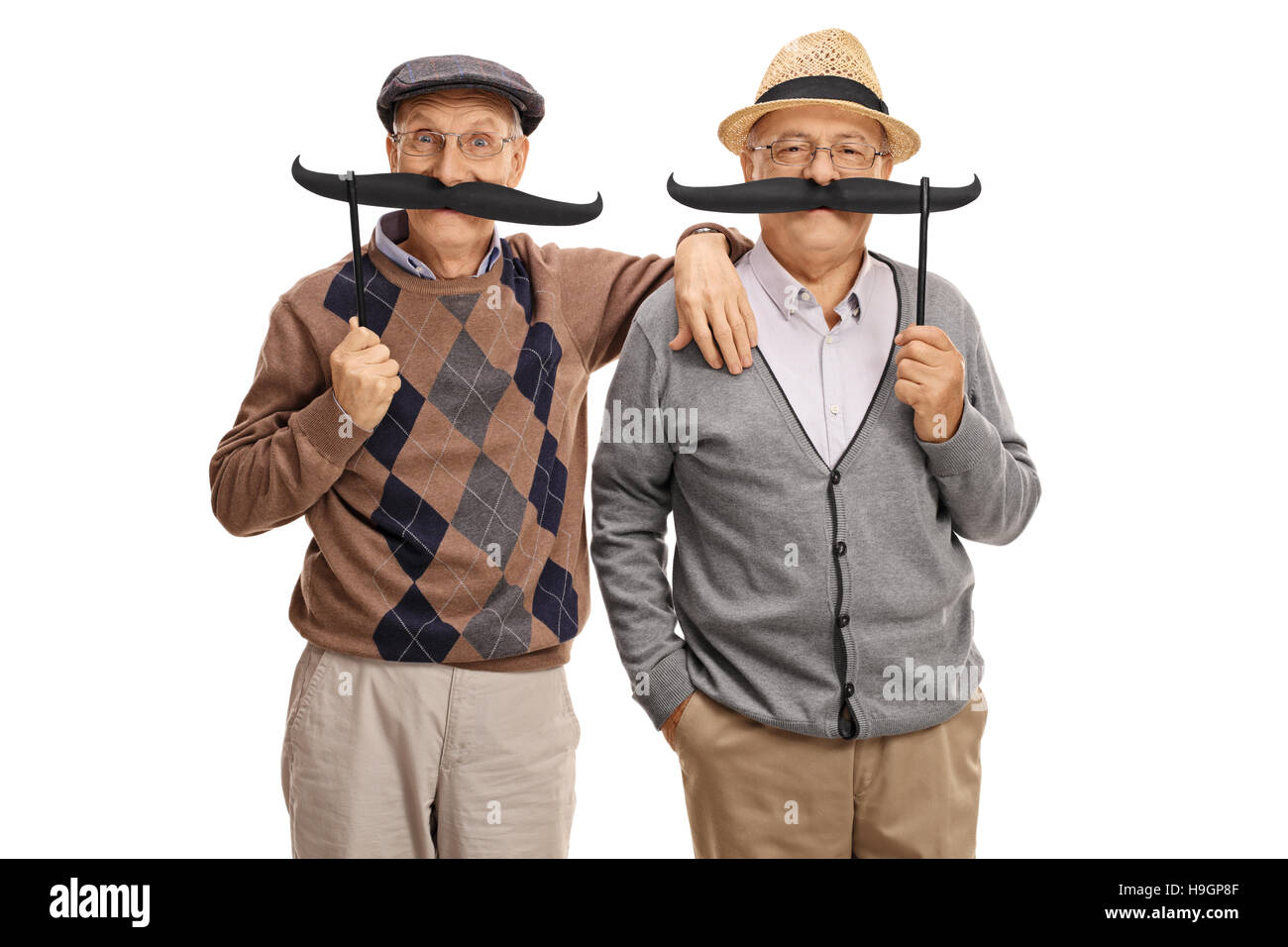 Senioren, posiert mit großen gefälschte Schnurrbart isoliert auf weißem Hintergrund Stockfoto