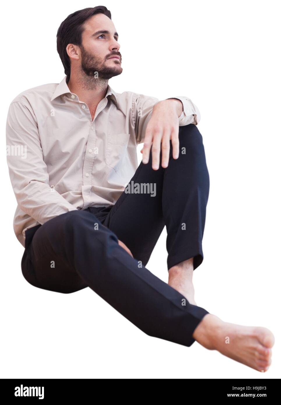 Mann auf dem Boden sitzend Stockfoto