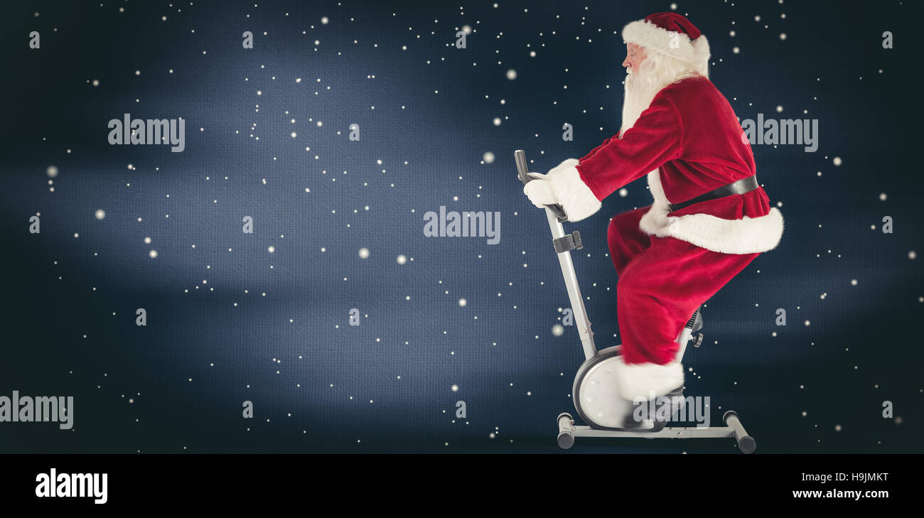 Zusammengesetztes Bild von Santa nutzt ein Hometrainer Stockfoto