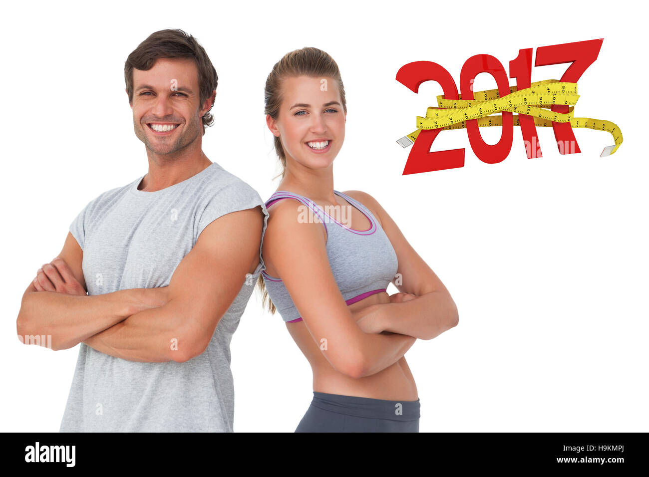 Zusammengesetztes 3D-Bild Porträt eines sportlichen jungen Paares mit Arme gekreuzt Stockfoto
