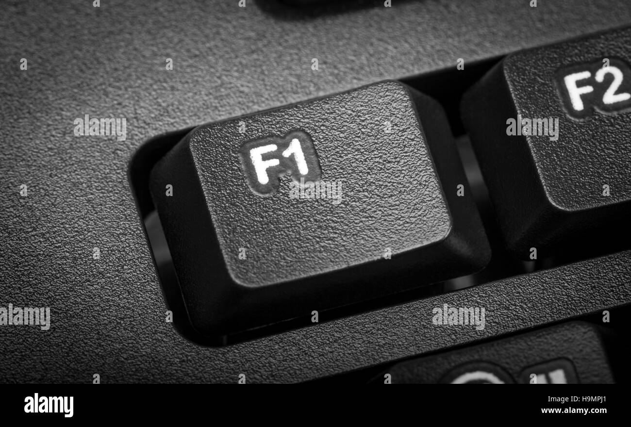 Elektronische Sammlung - Detail schwarz Computer-Tastatur. Der Fokus auf F1-Taste. Stockfoto