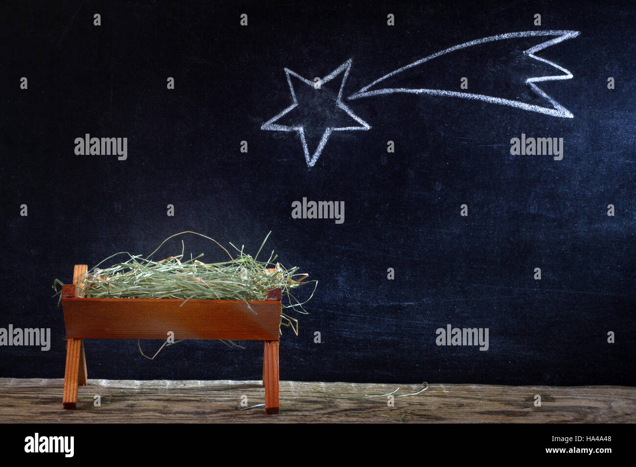 Geburt Jesu mit Krippe und Stern auf Tafel abstrakte Weihnachtskrippe Stockfoto