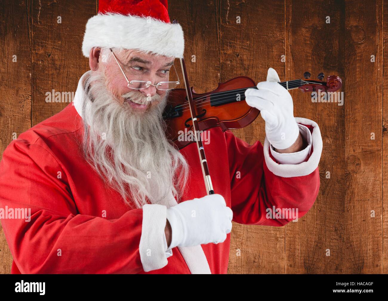 Weihnachtsmann spielen Violine Stockfoto