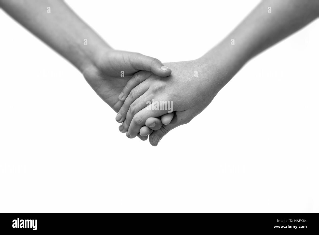 Junges Paar Holding Hände Closeup. Freundschaft, Liebe und Valentinstag-Konzept. Stockfoto