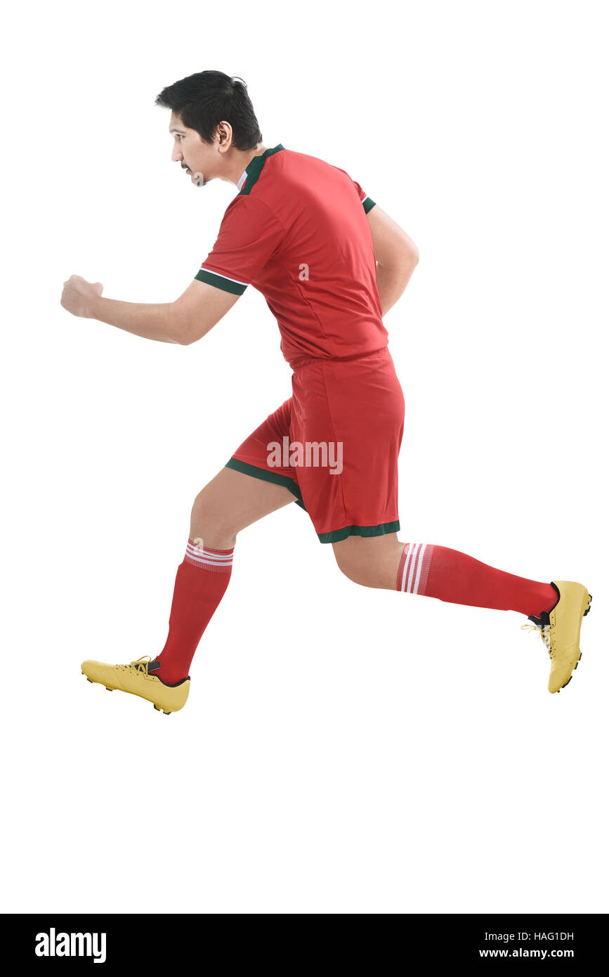 Bild des asiatischen Fußball-Spieler auf weißem Hintergrund läuft Stockfoto