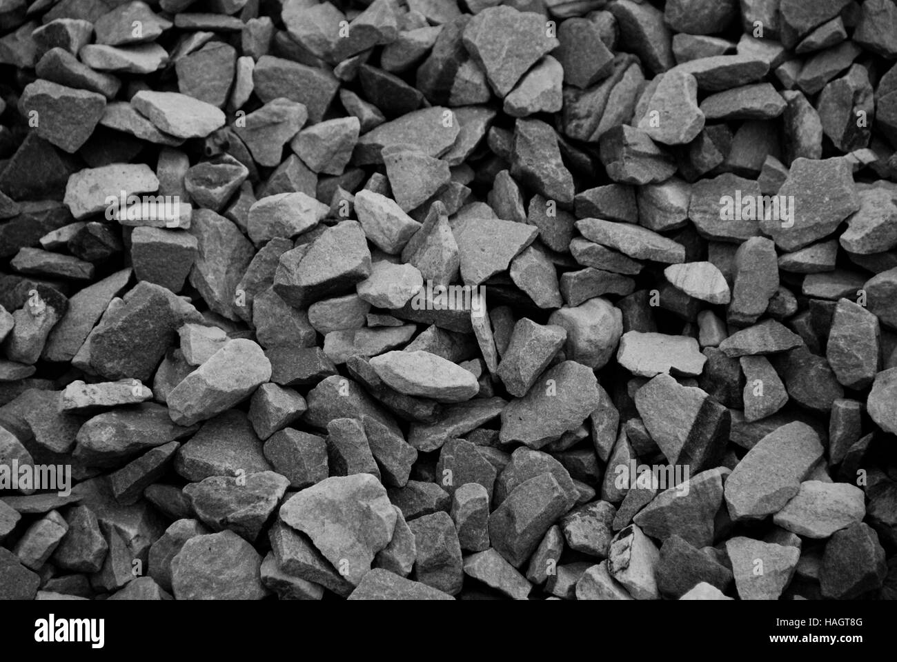 Schwarz / weiß Foto von Haufen von Kiesel Felsen als Hintergrund. Stockfoto