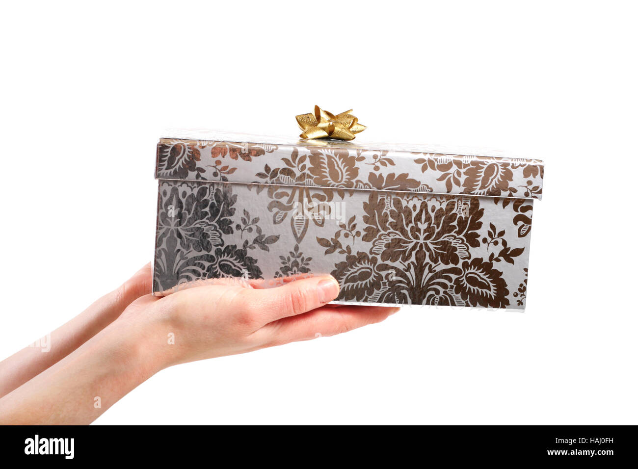 Geschenk-Box in den Händen isoliert auf weißem Hintergrund Stockfoto