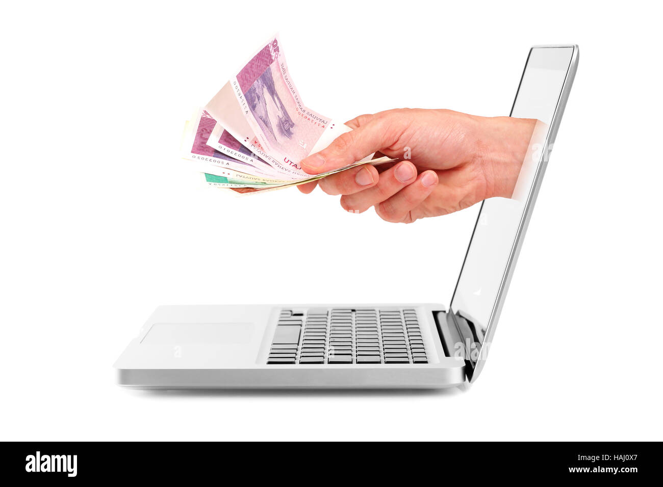 Hand mit Geld aus dem Laptop-display Stockfoto