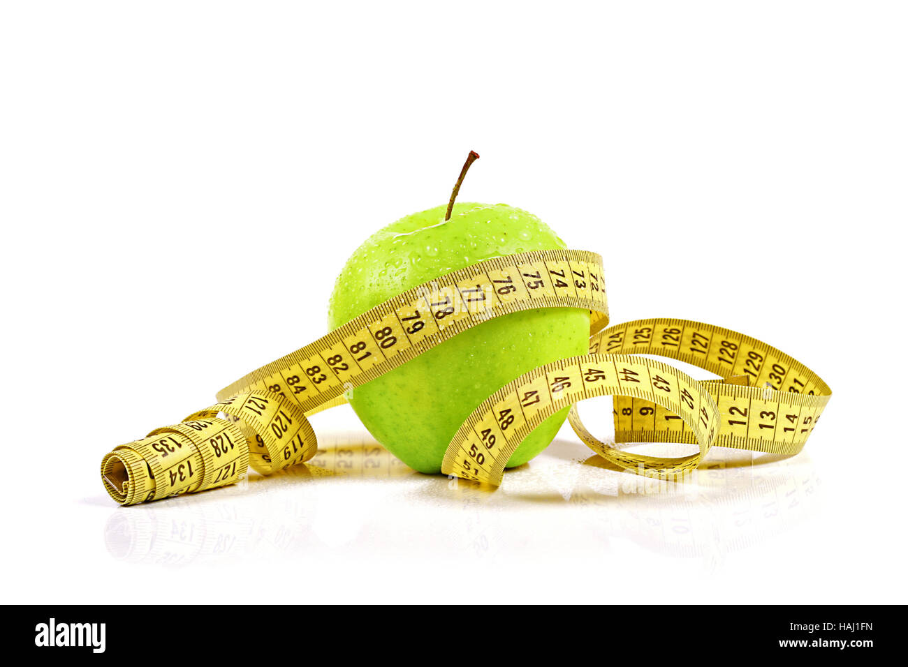 verlieren Sie Gewichtskonzept, Apfel mit Maßband Stockfoto