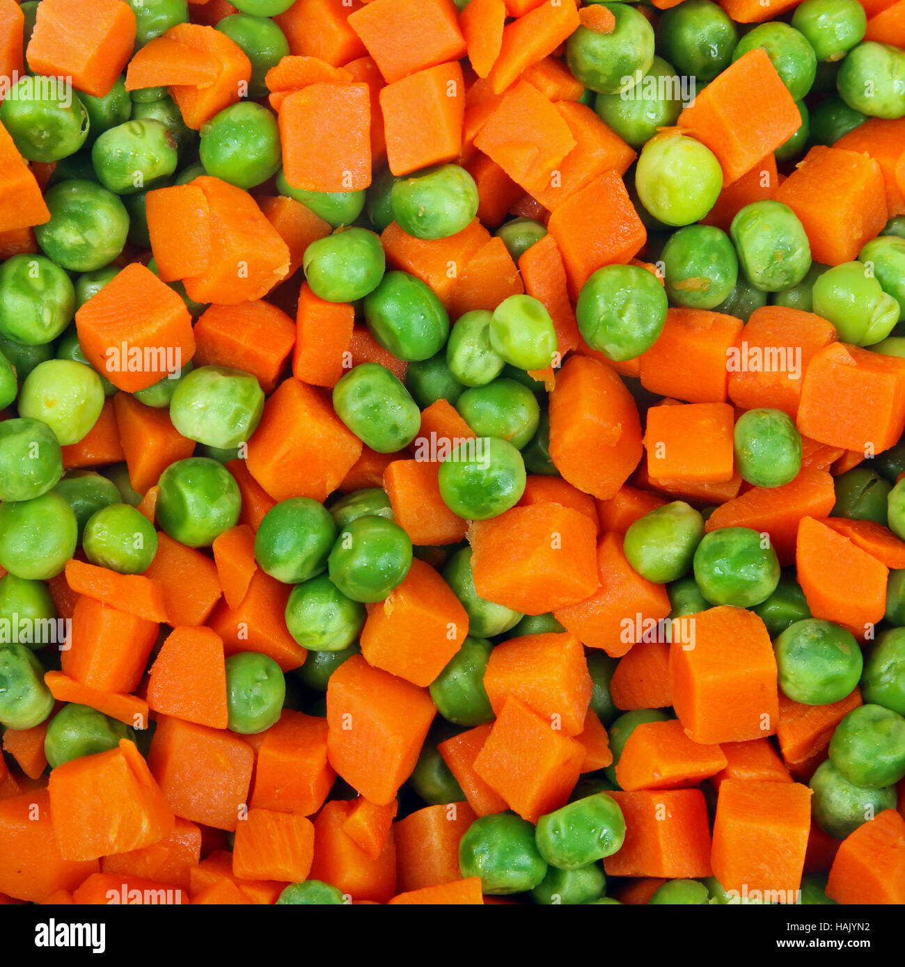Erbsen und Karotten Hintergrund Stockfoto