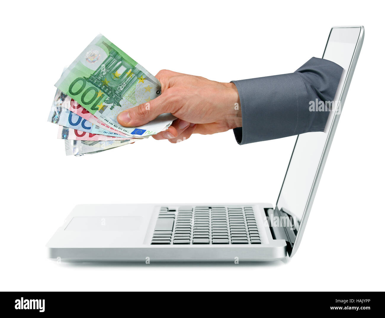 Internet-Einnahmen-Konzept - Hand mit Geld, die sich aus Laptop-Bildschirm Stockfoto