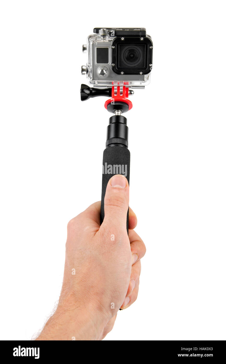 nehmen Selfie - Hand halten Einbeinstativ mit Action-Kamera Stockfoto