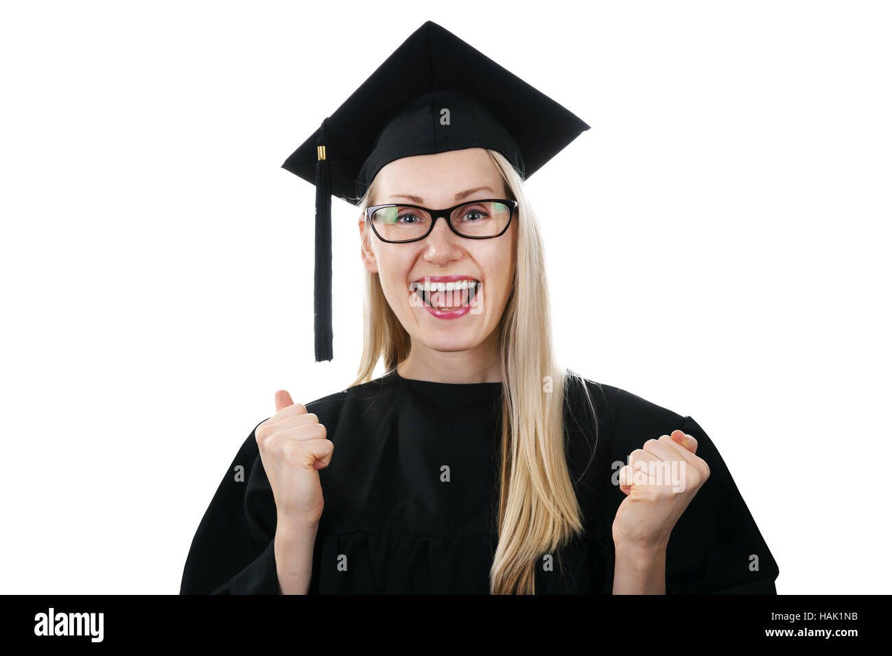 glücklich Hochschulabsolvent tragen Kleid und Mütze isoliert auf weiss Stockfoto