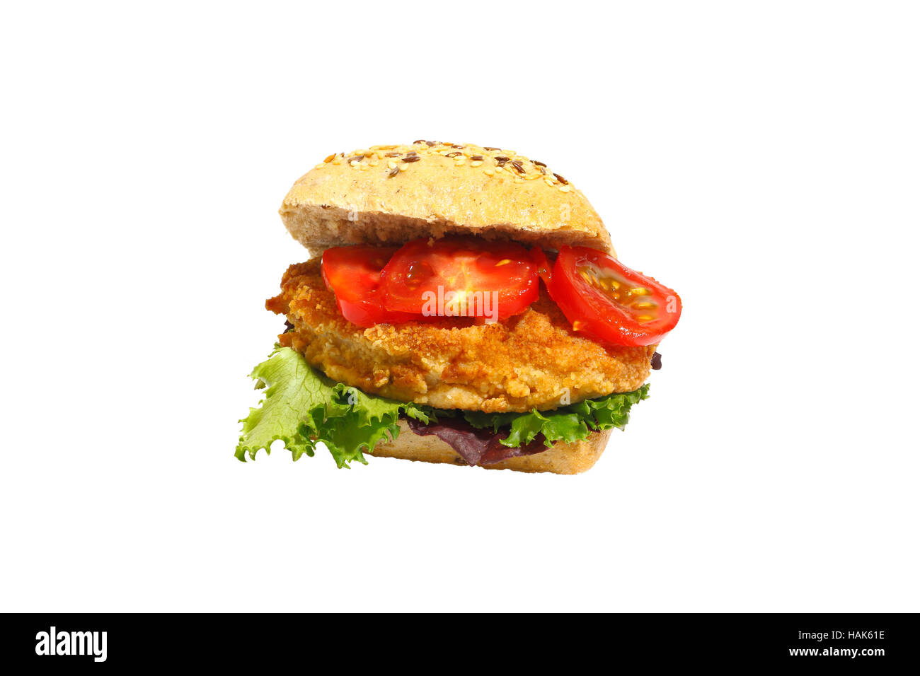 Korn-Brötchen mit gebratenem Schweinefleisch, Salat und Tomaten, isoliert Stockfoto