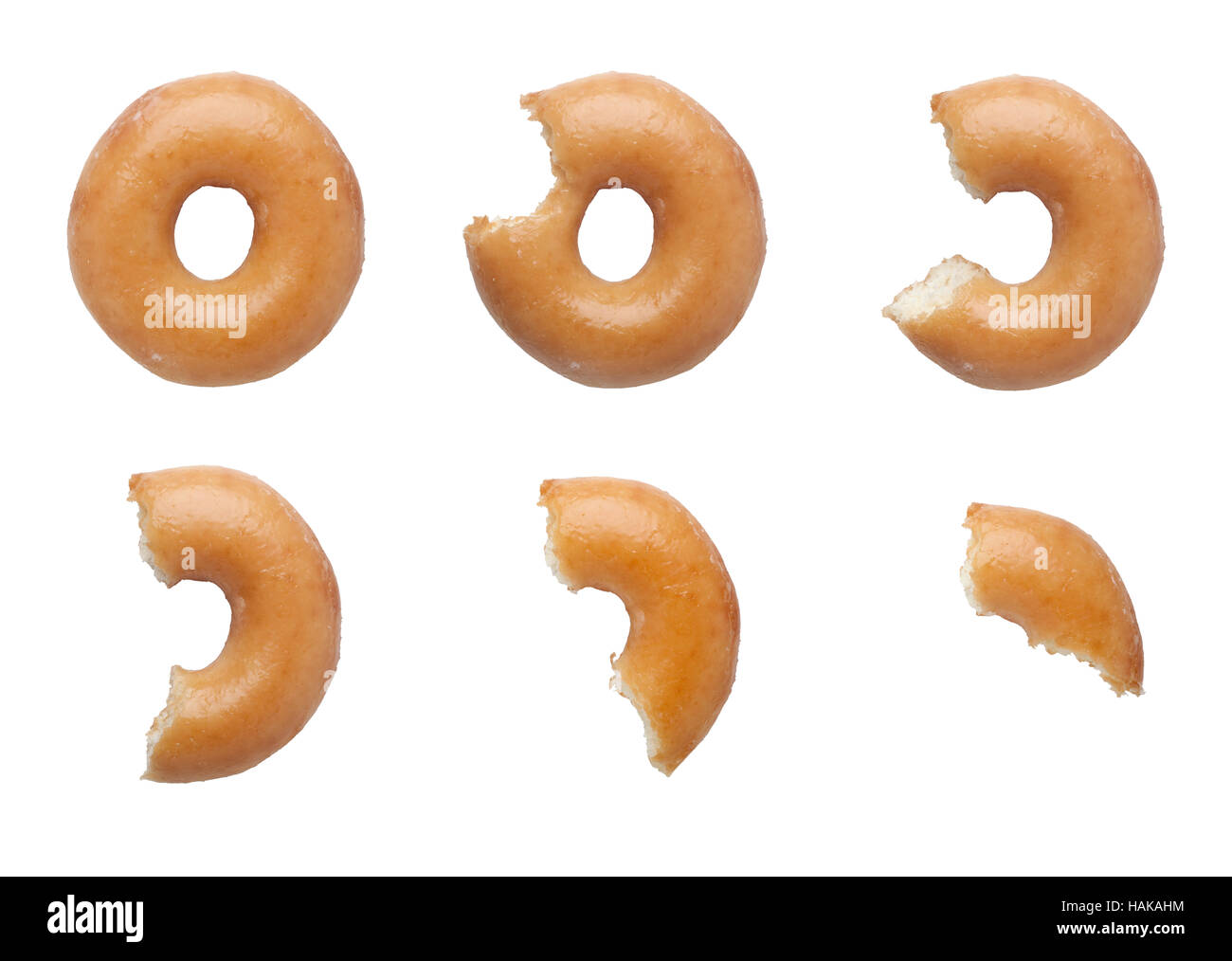Reihenfolge der Bisse abgenommen ein Donut isoliert auf weißem Hintergrund Stockfoto