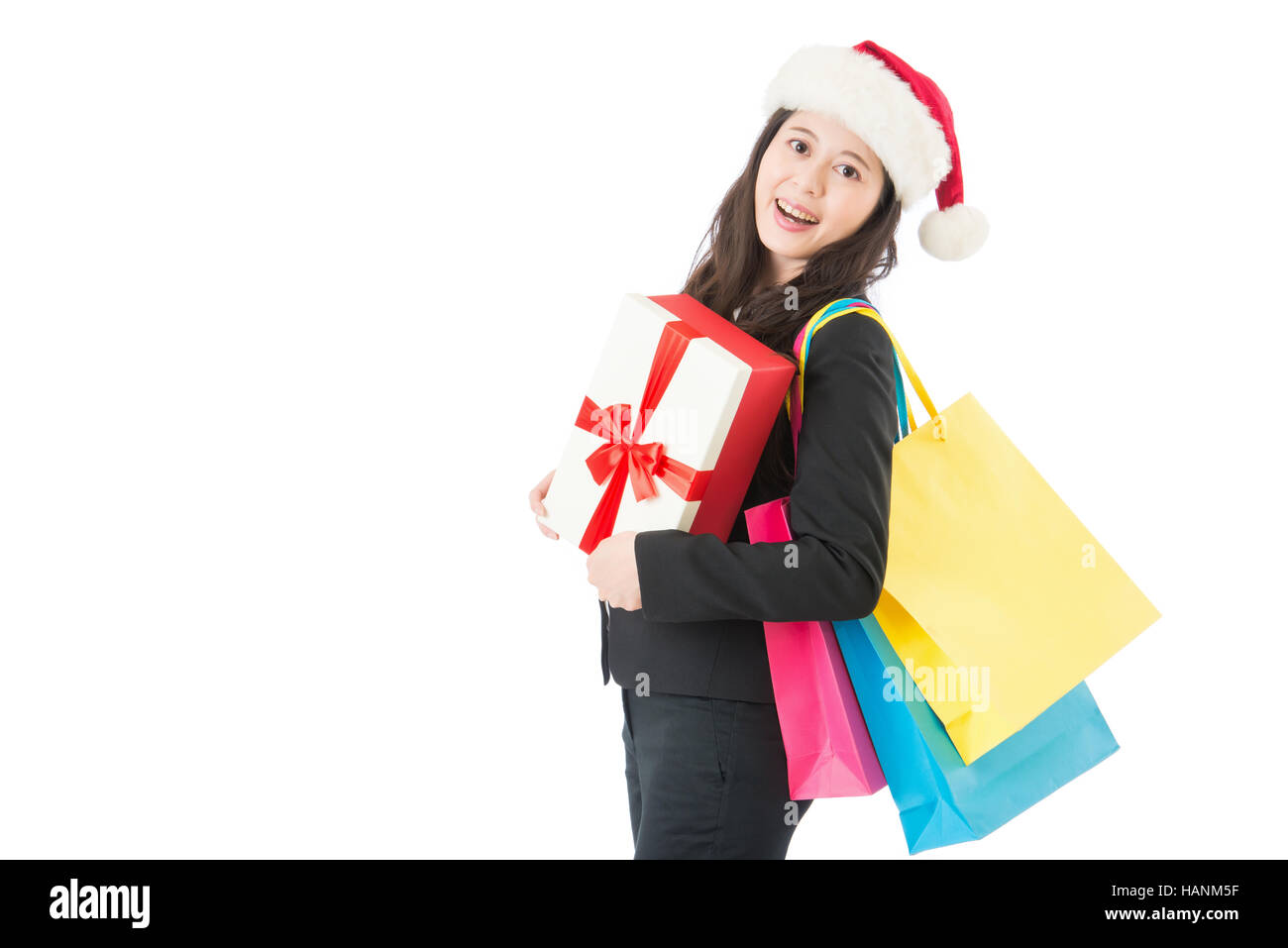 Weihnachts-shopping schön fröhliches Mädchen mit Einkaufstüten und Geschenk-Box. Weihnachtsgeschäft Konzept isoliert auf weißem Hintergrund Stockfoto