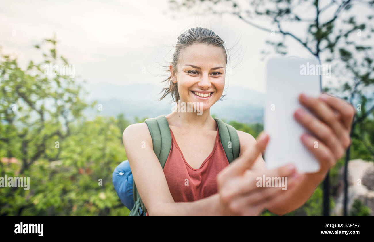 Frau nehmen Bilder Gerätekonzept Stockfoto