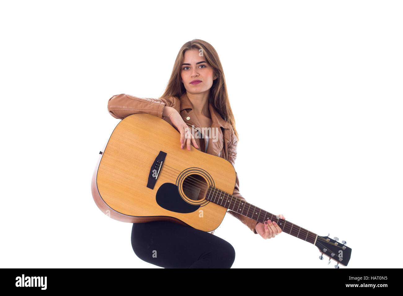 Junge Frau mit einer Gitarre Stockfoto