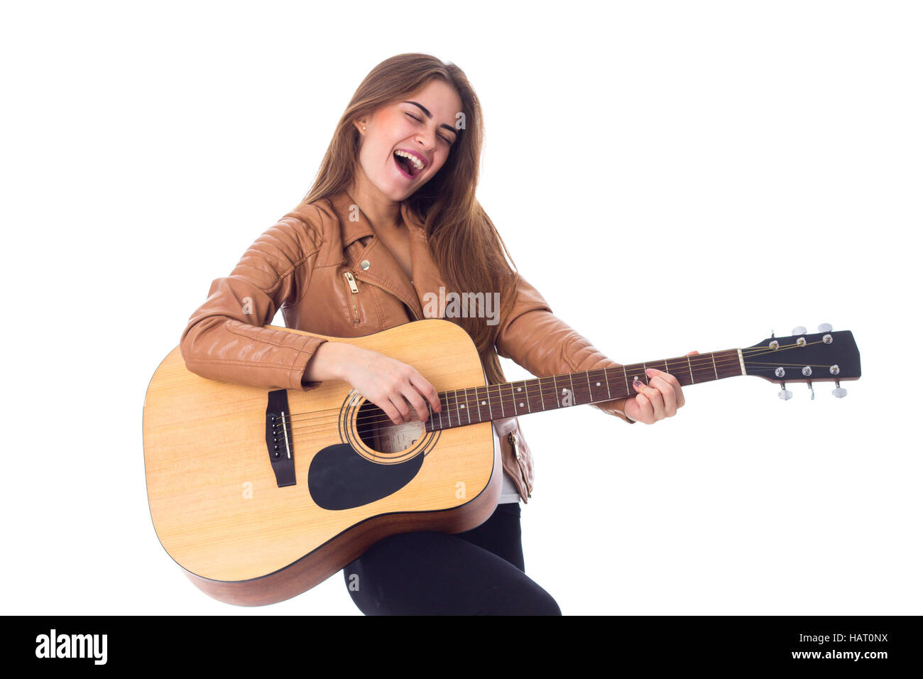 Junge Frau mit einer Gitarre Stockfoto