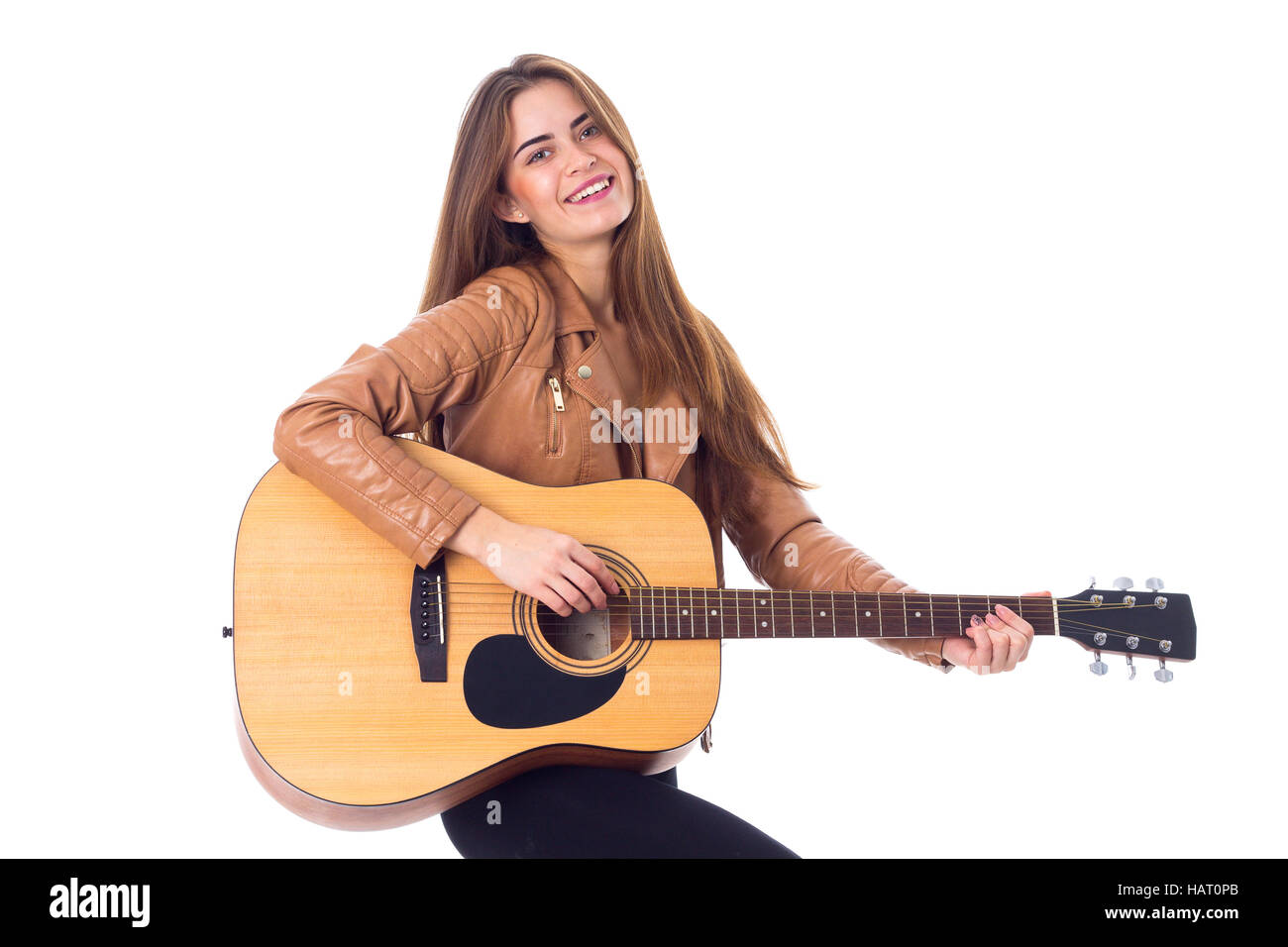 Junge Frau mit einer Gitarre Stockfoto