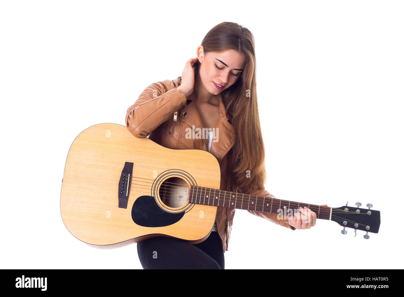 Junge Frau mit einer Gitarre Stockfoto