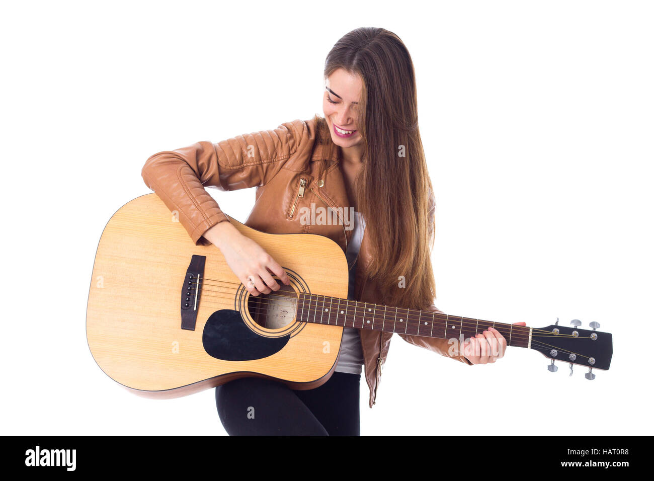 Junge Frau mit einer Gitarre Stockfoto