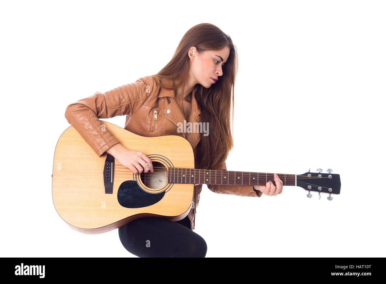 Junge Frau mit einer Gitarre Stockfoto