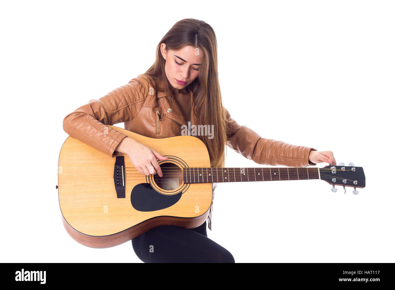 Junge Frau mit einer Gitarre Stockfoto