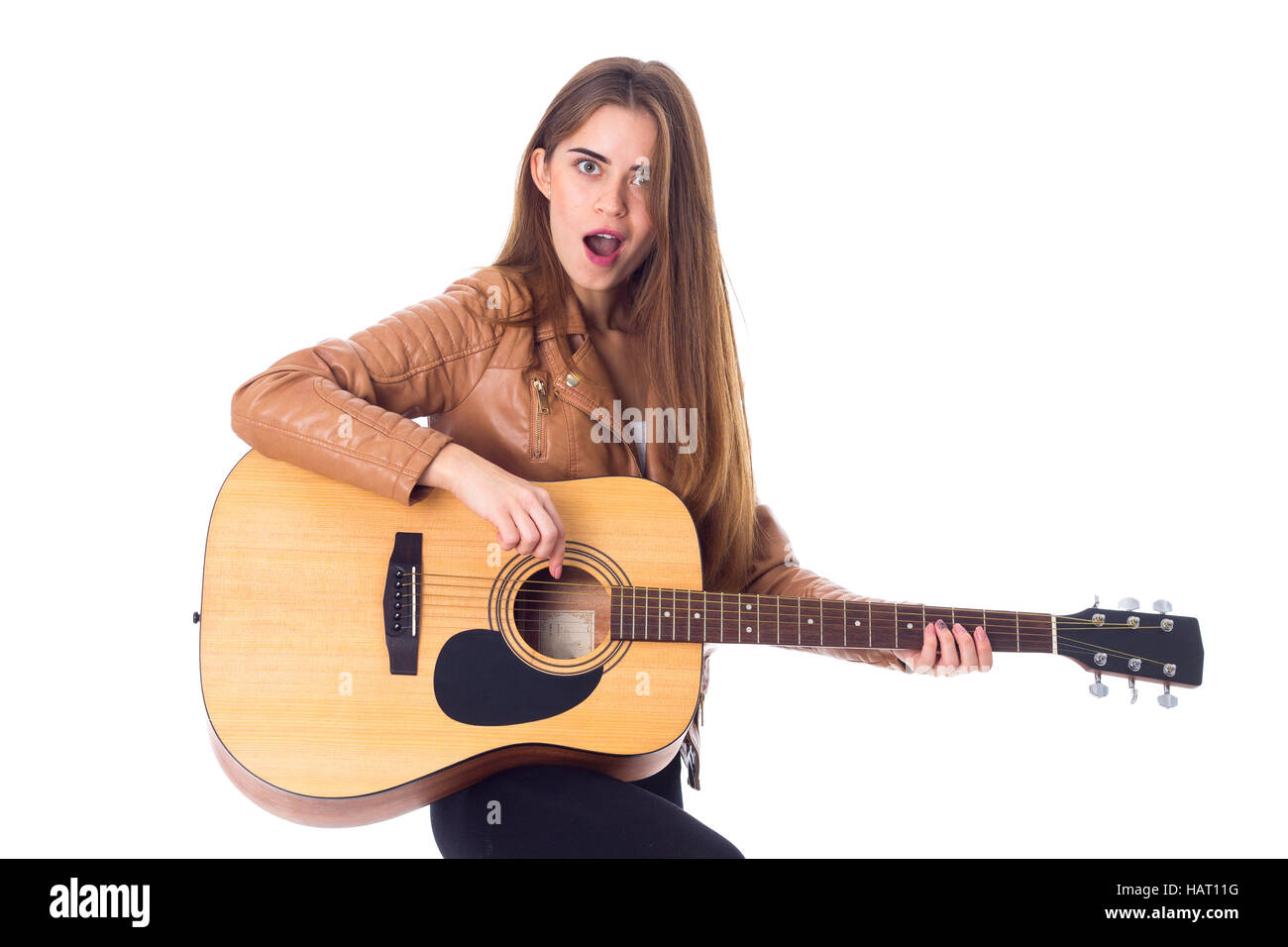 Junge Frau mit einer Gitarre Stockfoto