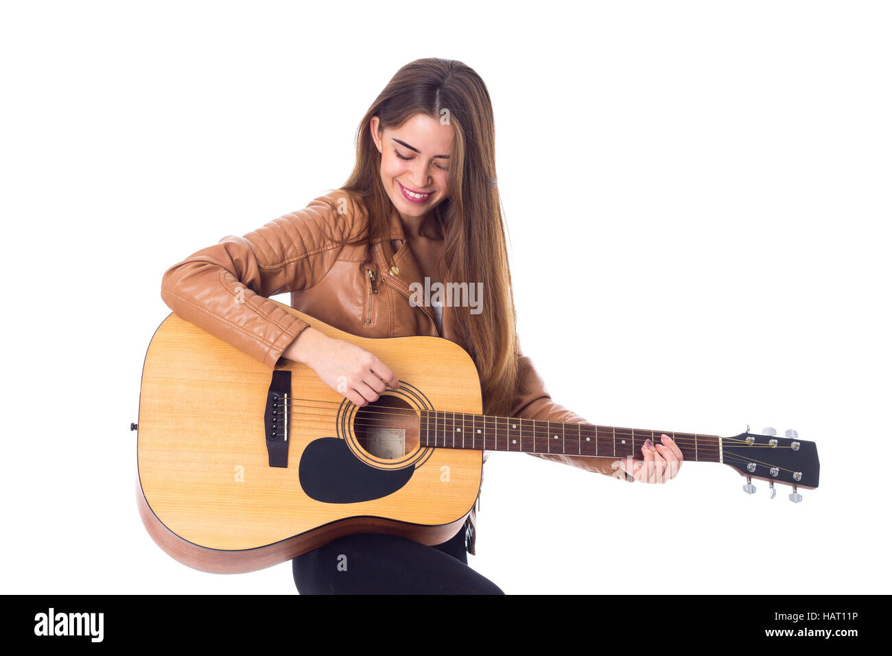 Junge Frau mit einer Gitarre Stockfoto