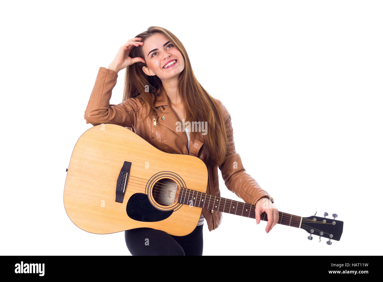 Junge Frau mit einer Gitarre Stockfoto