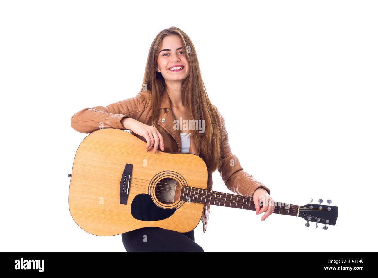 Junge Frau mit einer Gitarre Stockfoto